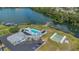 Aerial view of community amenities including pool, dock, and parking at 1112 Elkhart Cir, Tavares, FL 32778