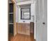 Bathroom with wooden cabinets, drawers, mirror, and plenty of space for storage at 1112 Elkhart Cir, Tavares, FL 32778