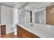 Bathroom featuring a large vanity with a sink, white tile and lighting at 1112 Elkhart Cir, Tavares, FL 32778