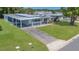 A well-kept mobile home features an extended carport and a lush, green lawn at 1112 Elkhart Cir, Tavares, FL 32778