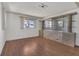Well-lit living room with hardwood floors and bar perfect for relaxation and entertaining guests at 1112 Elkhart Cir, Tavares, FL 32778
