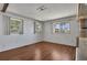 Inviting living room with natural light and hardwood floors, perfect for relaxation and entertaining at 1112 Elkhart Cir, Tavares, FL 32778