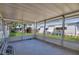 Covered patio with chairs and table that's great for enjoying the outdoors at 1112 Elkhart Cir, Tavares, FL 32778