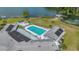 Enjoy community amenities with the lake view pool and patio area at 1112 Elkhart Cir, Tavares, FL 32778