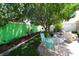 Lush backyard with a stone fountain, patio seating, and verdant greenery, ideal for outdoor gatherings at 1135 Easley Way, The Villages, FL 32162