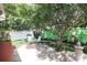 Landscaped backyard featuring a patio with seating and a decorative fountain, perfect for outdoor enjoyment at 1135 Easley Way, The Villages, FL 32162
