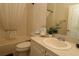 Well-lit bathroom featuring neutral fixtures, a shower-tub, and sink with vanity for everyday needs at 1135 Easley Way, The Villages, FL 32162