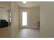 Inviting entryway with tiled flooring, neutral walls, and a clear glass back door at 1135 Easley Way, The Villages, FL 32162