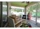 Inviting screened patio with comfortable seating and colorful decor, great for relaxing outdoors at 1135 Easley Way, The Villages, FL 32162