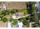 Expansive property featuring a screened pool, spacious backyard, and access to a serene lake at 11619 Lane Park Rd, Tavares, FL 32778