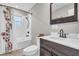 Cozy bathroom with updated fixtures, white subway tile, modern vanity and shower/tub combo at 11619 Lane Park Rd, Tavares, FL 32778
