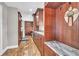 Hallway featuring rich wood cabinets, granite counters and wood floors at 11619 Lane Park Rd, Tavares, FL 32778