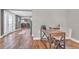 Inviting home office space with wood floors and view into the kitchen area at 11619 Lane Park Rd, Tavares, FL 32778