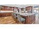 Beautiful kitchen showcasing granite counters, bar seating and natural light at 11619 Lane Park Rd, Tavares, FL 32778