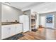 Bright kitchenette with white cabinets and butcher block countertop, plus refrigerator at 11619 Lane Park Rd, Tavares, FL 32778