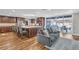 Open-concept living room showcasing a kitchen island and sliding doors to an outdoor patio area at 11619 Lane Park Rd, Tavares, FL 32778