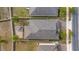 Overhead view of a home featuring a backyard brick patio with pergola at 118 Green Branch Blvd, Groveland, FL 34736