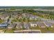 Aerial view of home and the surrounding community with a view of the lake at 118 Green Branch Blvd, Groveland, FL 34736