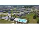 A scenic aerial view of the community, showcasing houses, a swimming pool, and green spaces in a well-planned neighborhood at 118 Green Branch Blvd, Groveland, FL 34736