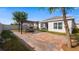 Private backyard with a brick patio, pergola, and a serene outdoor space for relaxation and entertainment at 118 Green Branch Blvd, Groveland, FL 34736