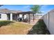 Backyard features a brick patio, dining set, grill, and covered pergola at 118 Green Branch Blvd, Groveland, FL 34736