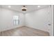 Bedroom with light, wood-look floors, a ceiling fan, and natural light at 118 Green Branch Blvd, Groveland, FL 34736
