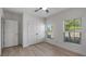 Light-filled bedroom with double closet, fan, and two windows overlooking the landscape at 118 Green Branch Blvd, Groveland, FL 34736