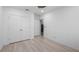 Bedroom with double closets and light, wood-look floors for easy cleaning at 118 Green Branch Blvd, Groveland, FL 34736
