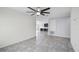 Open living space showcasing tile floors and connecting seamlessly to the kitchen and additional rooms at 118 Green Branch Blvd, Groveland, FL 34736