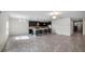 Spacious living area with tile floors, recessed lighting, and modern kitchen with a center island at 118 Green Branch Blvd, Groveland, FL 34736
