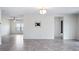 Open-concept living room with tiled flooring and ample space for entertaining at 118 Green Branch Blvd, Groveland, FL 34736