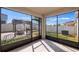 View of screened-in patio with dining area and outdoor grill under a pergola at 118 Green Branch Blvd, Groveland, FL 34736