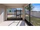Screened-in patio provides tranquil view of outdoor pergola dining area at 118 Green Branch Blvd, Groveland, FL 34736