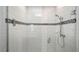Modern shower showcasing white tile, decorative tile border, a glass door, and contemporary fixtures at 118 Green Branch Blvd, Groveland, FL 34736