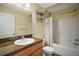 Bathroom featuring vanity with solid surface counters, modern fixtures, and shower-tub combo at 12370 Se 100Th Ct, Belleview, FL 34420