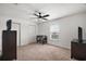 This bedroom has a ceiling fan, a foosball table, and two dressers at 12370 Se 100Th Ct, Belleview, FL 34420