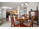 Open-concept dining area adjacent to the kitchen, featuring a wooden table and view of the living space at 12370 Se 100Th Ct, Belleview, FL 34420