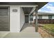Charming front entrance with covered porch, stylish pillars, manicured landscaping at 12370 Se 100Th Ct, Belleview, FL 34420