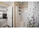 This bathroom features a shower with plastic surround, plus a decorative shower curtain at 12370 Se 100Th Ct, Belleview, FL 34420