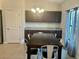 Dining room with chandelier and dark wood table at 12807 Sugar Ct, Grand Island, FL 32735
