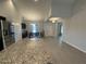 Kitchen with stainless steel refrigerator open to dining area at 12807 Sugar Ct, Grand Island, FL 32735