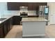 Well-equipped kitchen with stainless steel appliances and granite countertops at 12807 Sugar Ct, Grand Island, FL 32735