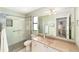 Bathroom featuring a walk-in shower, a vanity with countertop, and a neutral color scheme at 1310 Leone Ln, The Villages, FL 32159