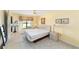 Cozy bedroom offers natural light and comfortable carpeting at 1310 Leone Ln, The Villages, FL 32159