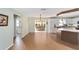 Open-concept kitchen featuring an island and stainless steel appliances at 1310 Leone Ln, The Villages, FL 32159