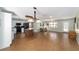 Bright open-concept kitchen featuring an island, stainless appliances, and ample counter space at 1310 Leone Ln, The Villages, FL 32159