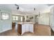 Spacious kitchen featuring an island and stainless steel appliances at 1310 Leone Ln, The Villages, FL 32159