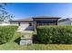 Cozy home with a screened-in lanai and a well-maintained lawn, perfect for relaxation and outdoor activities at 1310 Leone Ln, The Villages, FL 32159