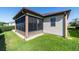 Enclosed screened-in lanai, offering a comfortable space to enjoy the outdoors while protected from insects at 1310 Leone Ln, The Villages, FL 32159