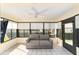 Cozy sunroom with sofa and ample windows at 1310 Leone Ln, The Villages, FL 32159